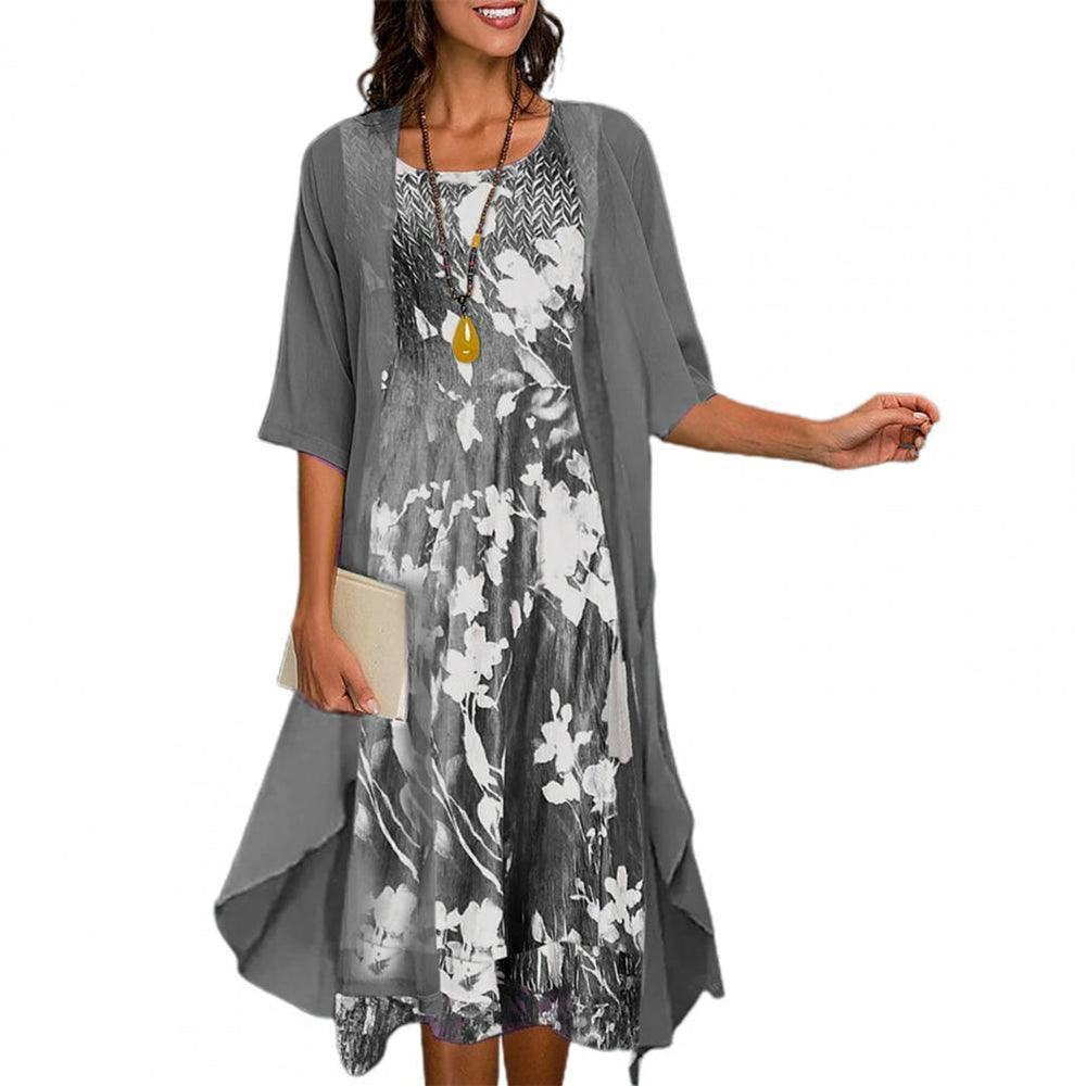 Elegante, lichtgewicht groene zomerjurk met verfijnde print en soepele pasvorm voor warme dagen.