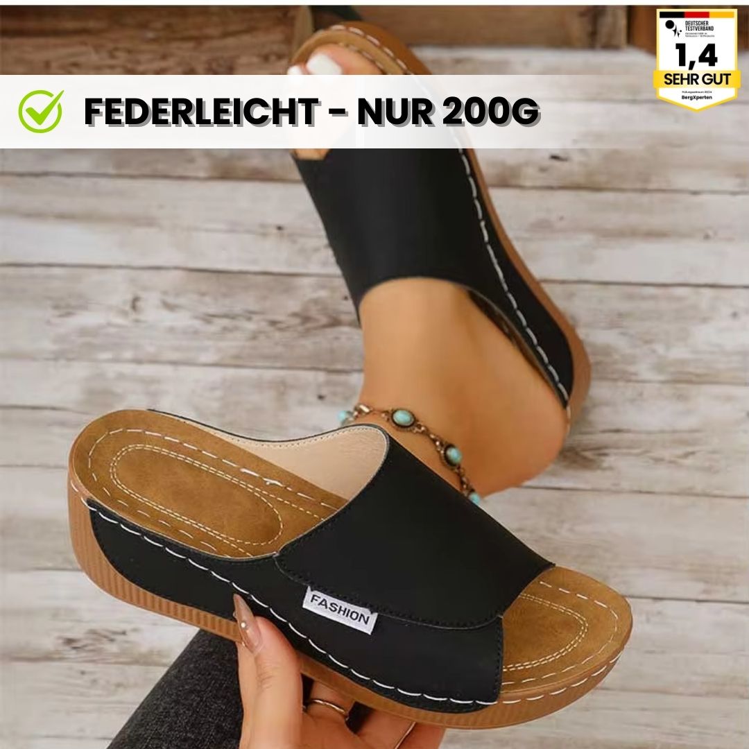 Ergonomische, antislip dames badslippers in het wit, ideaal voor comfort en stabiliteit.