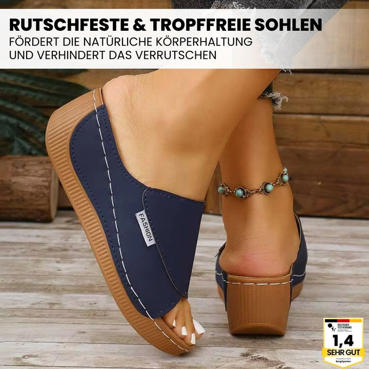 Ergonomische, antislip dames badslippers in het wit, ideaal voor comfort en stabiliteit.