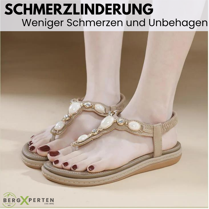 Bovenaanzicht van de abrikooskleurige OrthoPearl sandalen, toont de brede banden en het ergonomische voetbed.