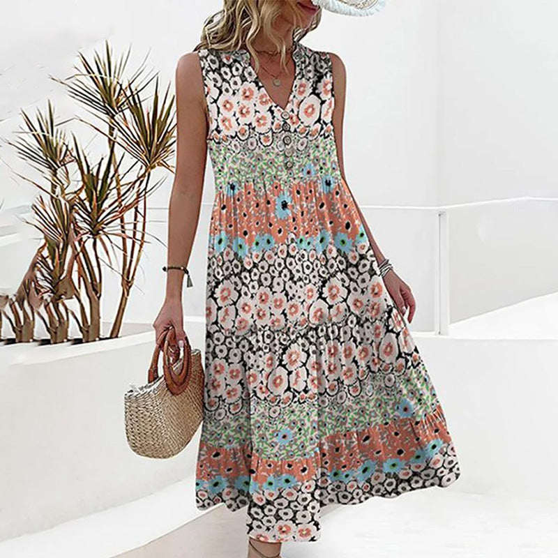 Mouwloze dames zomerjurk met V-hals en elegant bloemenpatroon in lichtroze, perfect voor de zomer.