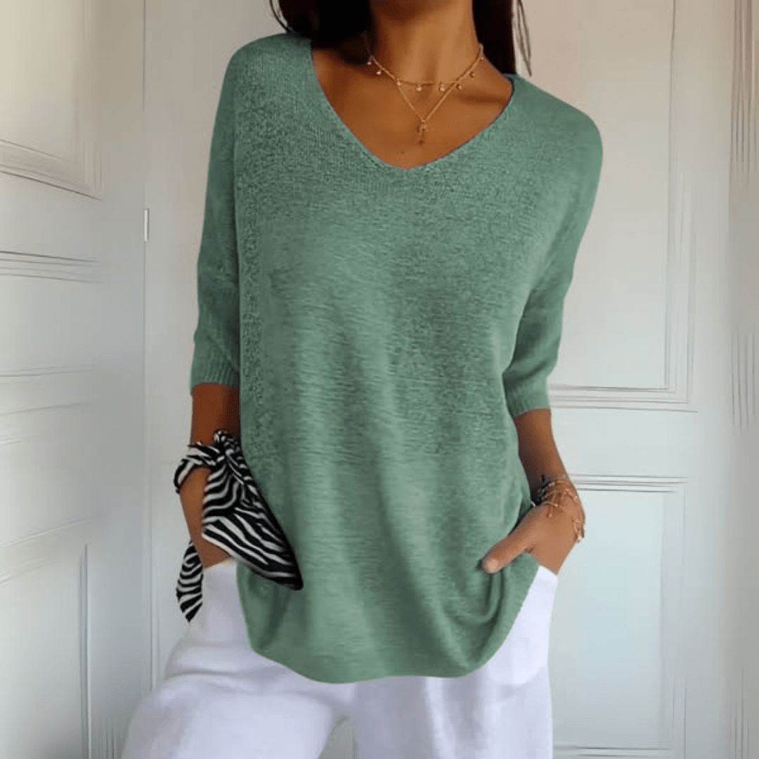 Gebreide dames top met V-hals in grijs, comfortabel en elegant design, veelzijdig te combineren.
