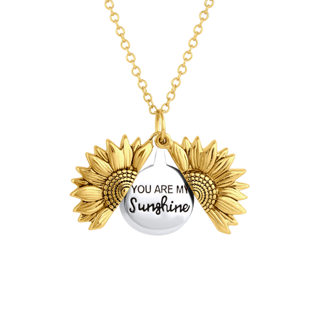 Gouden damesketting met gedetailleerde zonhanger, perfect als geschenk en symbool voor geluk en energie.