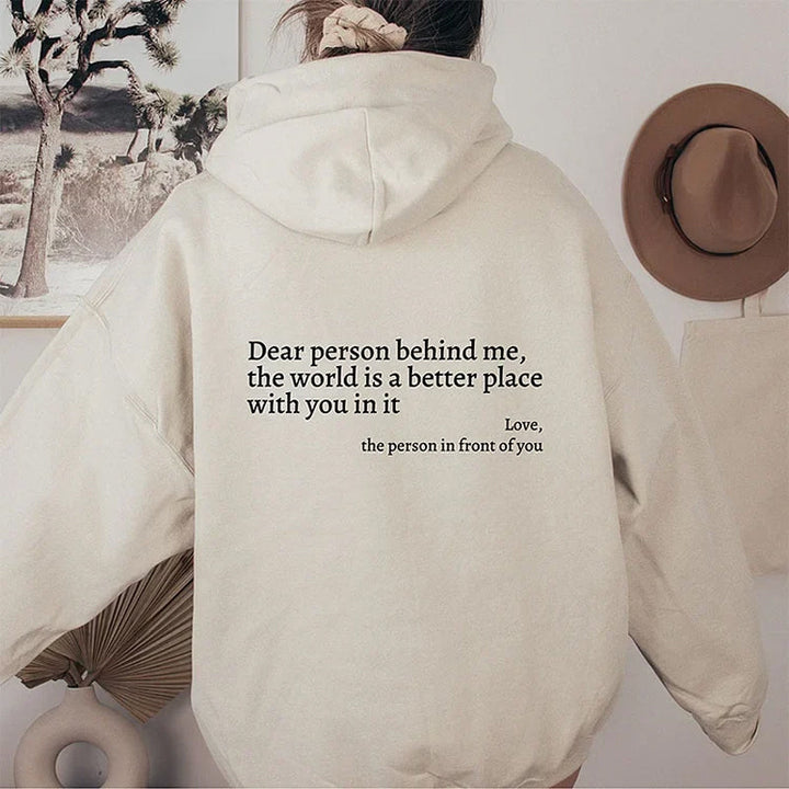 Grijze dames hoodie met opgedrukte tekst, comfortabel en modieus.