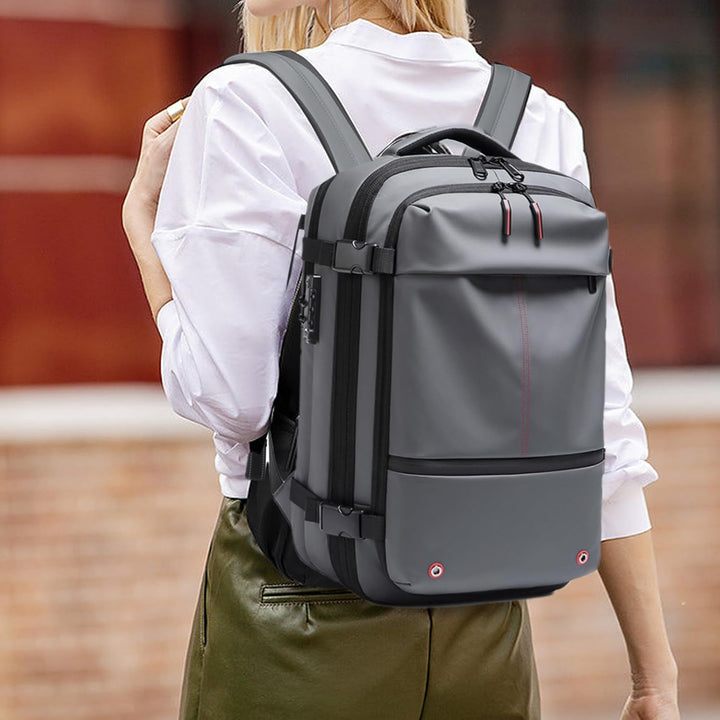 Unisex reisrugzak, grijs, 60L, met vacuümcompressie en waterdicht laptopvak. Efficiënt en praktisch.