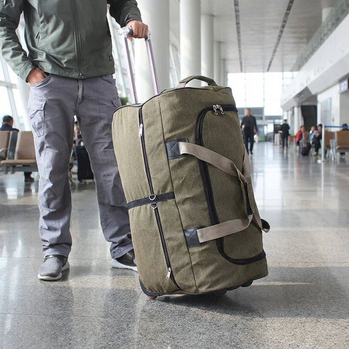 Grote unisex canvas reistas met wielen, ideaal voor comfortabel en robuust reizen.