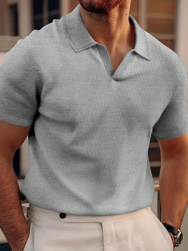 Klassiek heren poloshirt met korte mouwen en kraag, comfortabel en stijlvol, essentieel voor elke man.