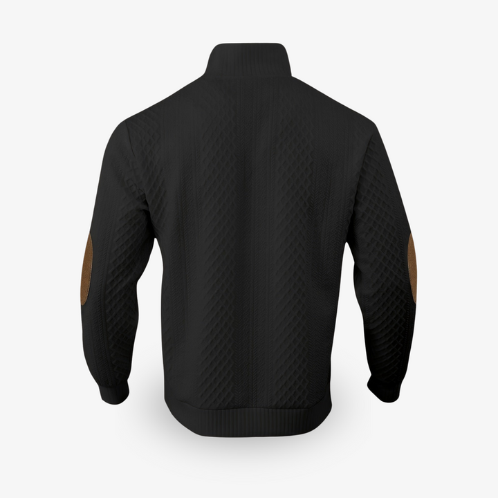 Gebreide luxe herentrui met prominent kabelpatroon en chique elleboogstukken. Perfect voor koude dagen.