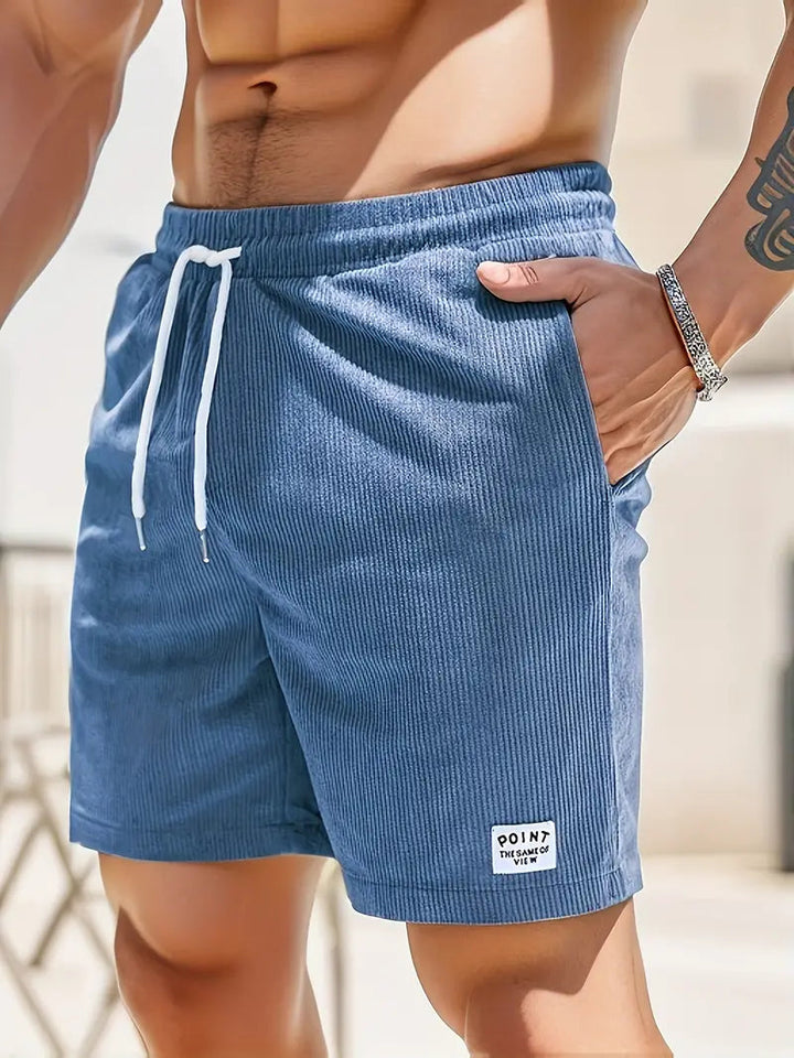 Zwarte VUMO heren casual shorts, essentieel voor zomerse dagen en strandactiviteiten.