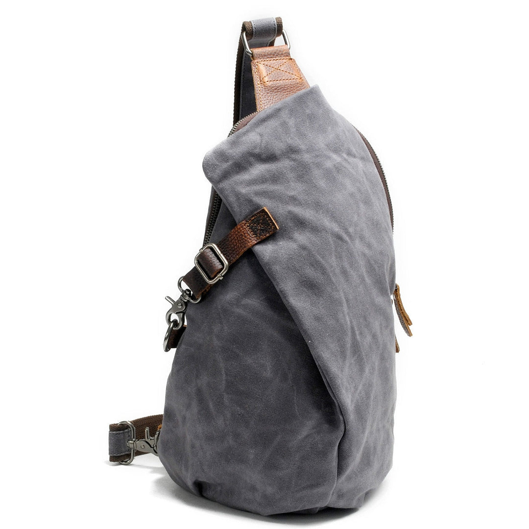 Duurzame heren waterdichte canvas crossbody tas, slijtvast en met praktisch antidiefstalvak.