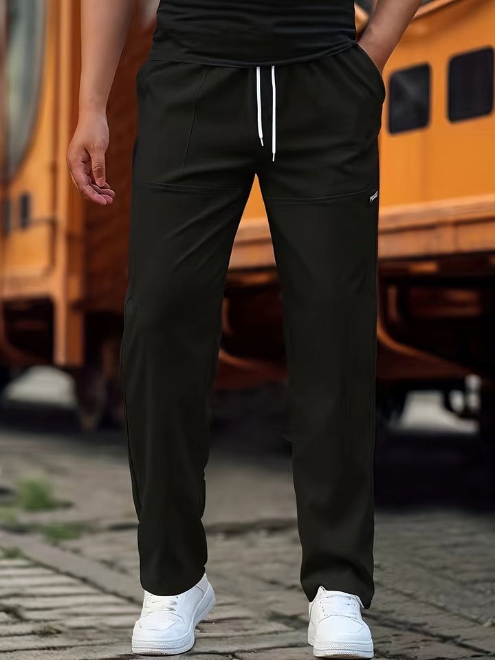Heren casual broek met jogger design in donkerblauw, stijlvolle snit, comfortabele pasvorm, katoenmix, praktische zakken