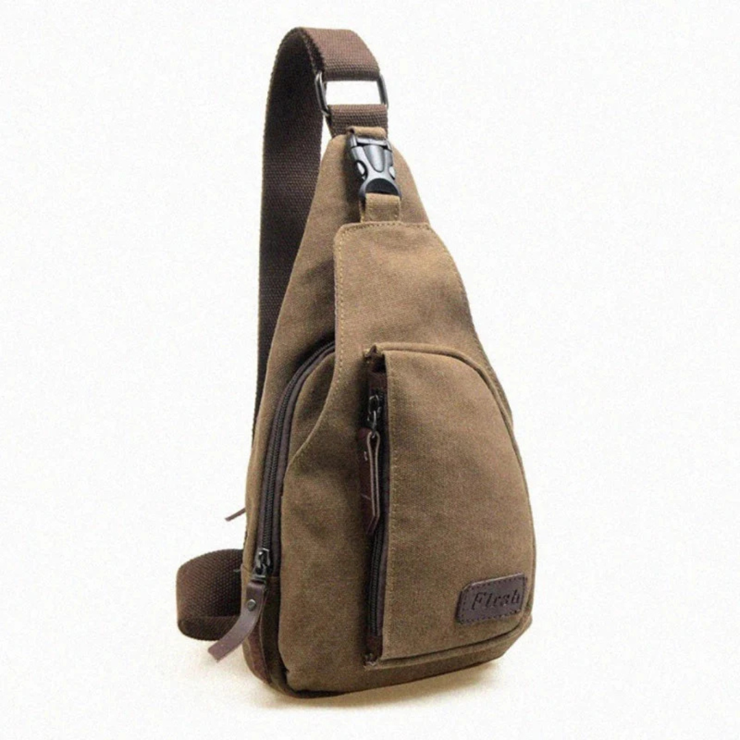 Crossbody borsttas voor mannen met verstelbare riem en ruime opbergruimte.