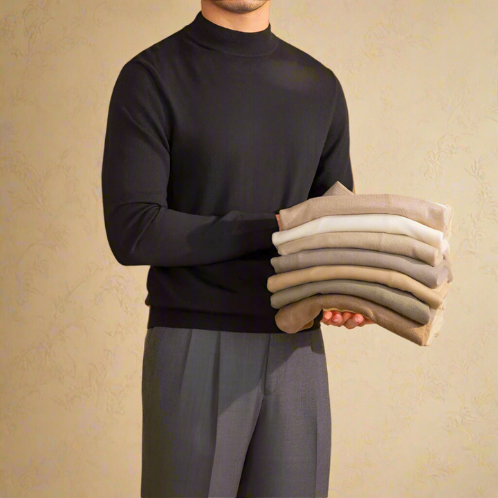 Een man draagt een bruine wollen coltrui, straalt elegantie en klassieke stijl uit, perfect voor zowel formele als casual gelegenheden.