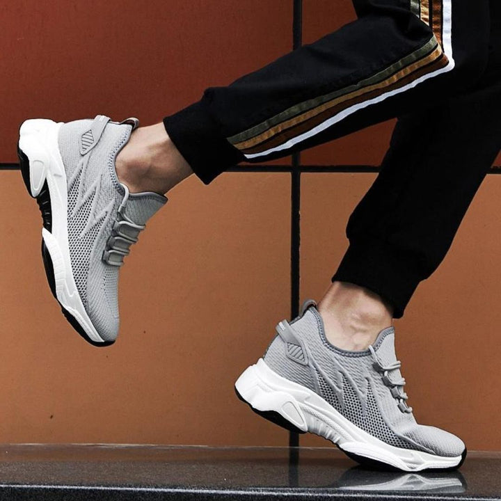 Heren sportschoenen, ademend en lichtgewicht, met verhoogde hak, moderne look, voor sport en vrije tijd, grijze variant.