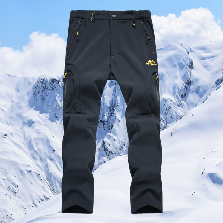 Heren thermische outdoorbroek, waterdicht, ademend, blauw, robuust, ideaal voor wandelen en kamperen, gemaakt van weerbestendig materiaal.
