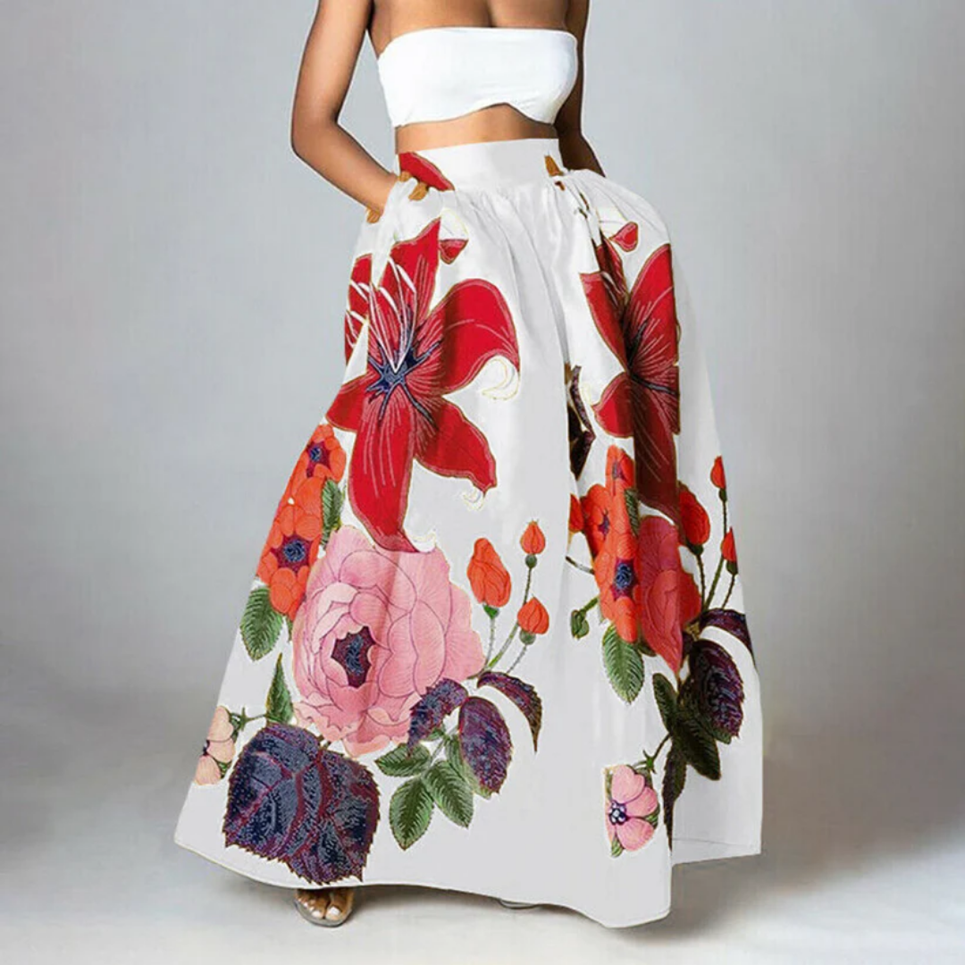 Elegante dames maxi-rok met hoge taille en bloemenprint. De rok is lang en golvend voor een vrouwelijke zomerlook.