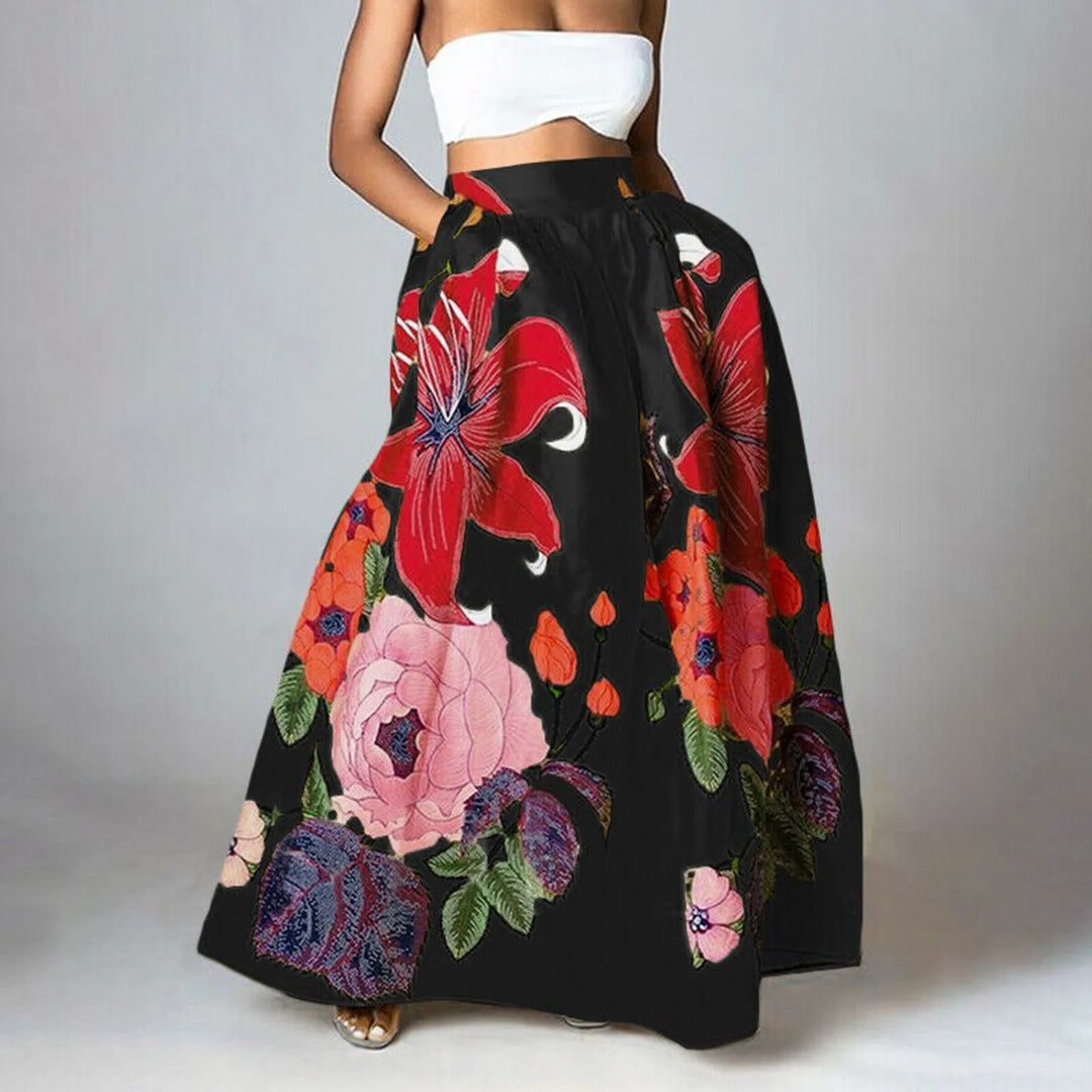 Elegante dames maxi-rok met hoge taille en bloemenprint. De rok is lang en golvend voor een vrouwelijke zomerlook.
