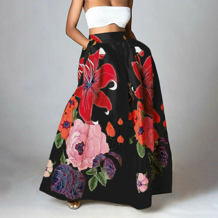 Elegante dames maxi-rok met hoge taille en bloemenprint. De rok is lang en golvend voor een vrouwelijke zomerlook.