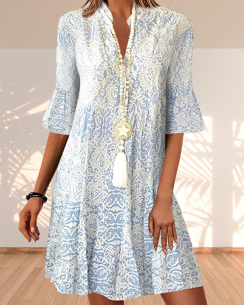 Ibiza midijurk voor dames in bloemenprint, met elegante losse mouwen, perfect voor zowel casual als chique momenten.
