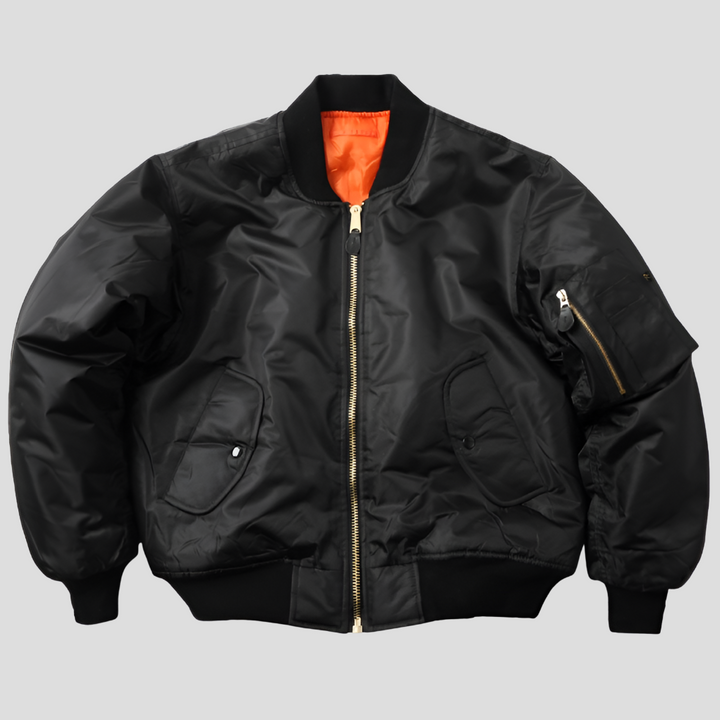 Klassiek zwart unisex bomberjack; tijdloze overgangsjas van polyester voor dames en heren.