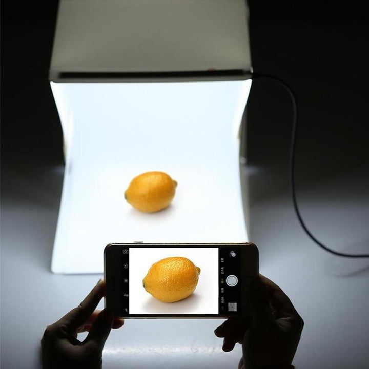 Compacte fotostudio lichtbox met LED-licht, witte achtergrond en draagtas voor hoogwaardige huisfotografie
