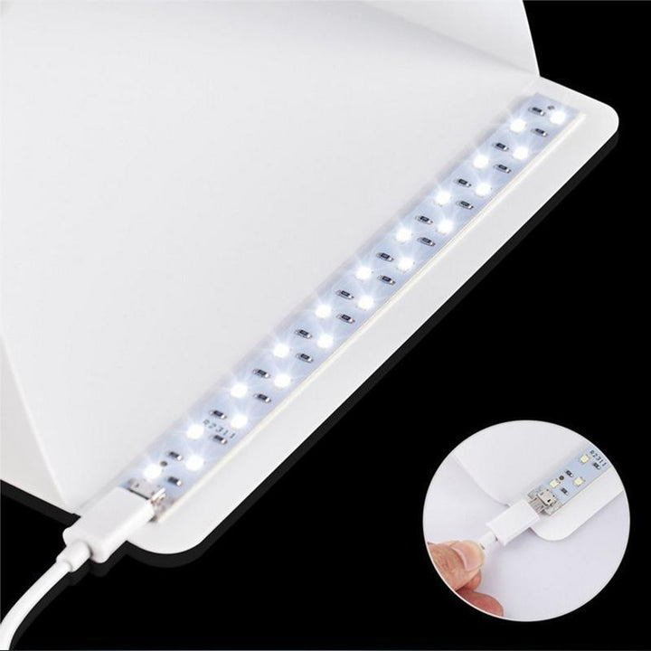 Compacte fotostudio lichtbox met LED-licht, witte achtergrond en draagtas voor hoogwaardige huisfotografie