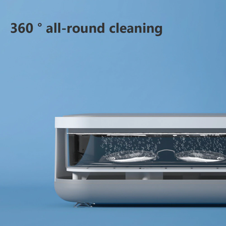 Compacte witte ultrasoonreiniger, ideaal voor 360° reiniging van sieraden en brillen; efficiënte technologie voor thuis.