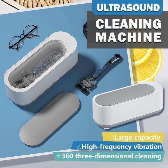 Compact ultrasoon reinigingsapparaat in wit en grijs voor sieraden, brillen, horloges; efficiënte 360°-dieptereiniging.
