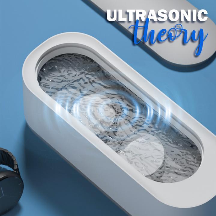 Compact ultrasoon reinigingsapparaat in wit en grijs voor sieraden, brillen, horloges; efficiënte 360°-dieptereiniging.