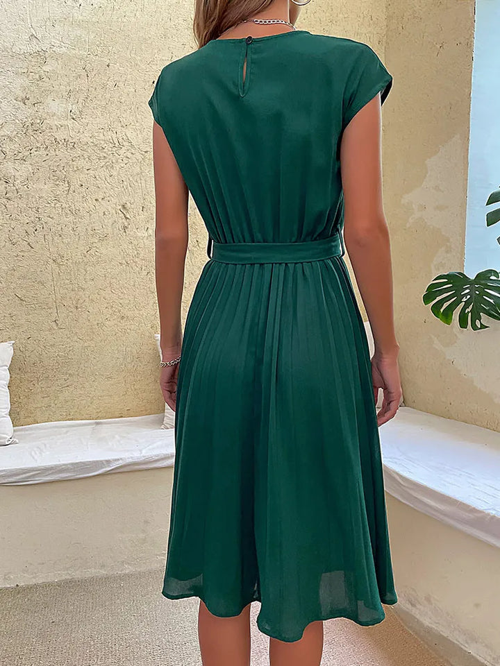 Elegant plissé minijurkje voor dames, met korte mouwen, in zachte kleuren en een flatterende pasvorm, perfect voor de zomer en verschillende gelegenheden.