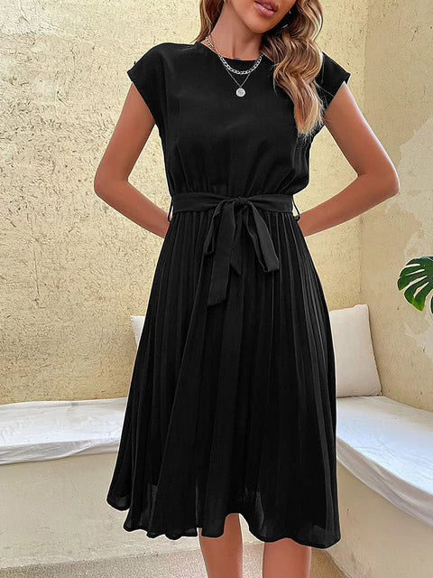 Elegant plissé minijurkje voor dames, met korte mouwen, in zachte kleuren en een flatterende pasvorm, perfect voor de zomer en verschillende gelegenheden.