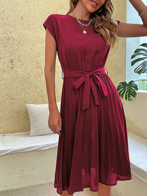 Elegant plissé minijurkje voor dames, met korte mouwen, in zachte kleuren en een flatterende pasvorm, perfect voor de zomer en verschillende gelegenheden.