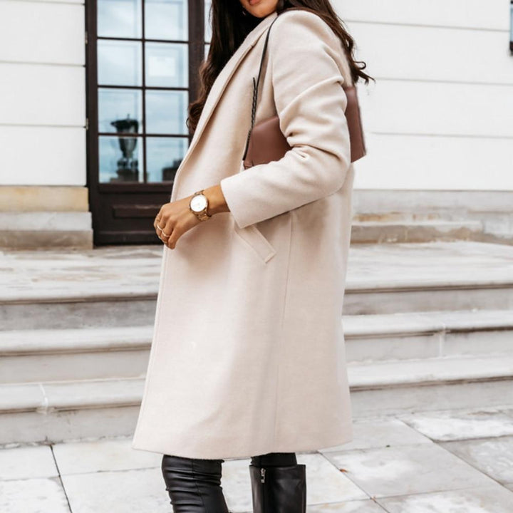 Chique lange kasjmier damesjas, elegant design met reverskraag, ideale wintermode. Warm en stijlvol.