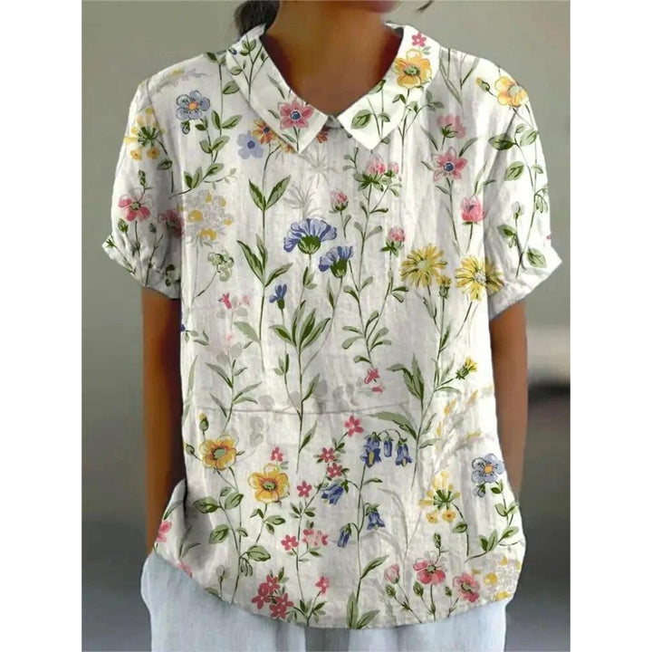 Casual damesblouse met bloemenprint, gemaakt van lichtgewicht katoen, ronde hals en korte mouwen voor zomerse dagen.