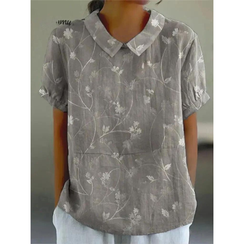 Casual damesblouse met bloemenprint, gemaakt van lichtgewicht katoen, ronde hals en korte mouwen voor zomerse dagen.