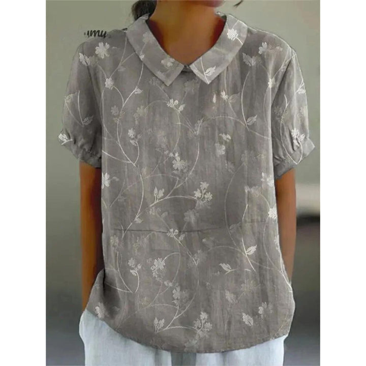 Casual damesblouse met bloemenprint, gemaakt van lichtgewicht katoen, ronde hals en korte mouwen voor zomerse dagen.