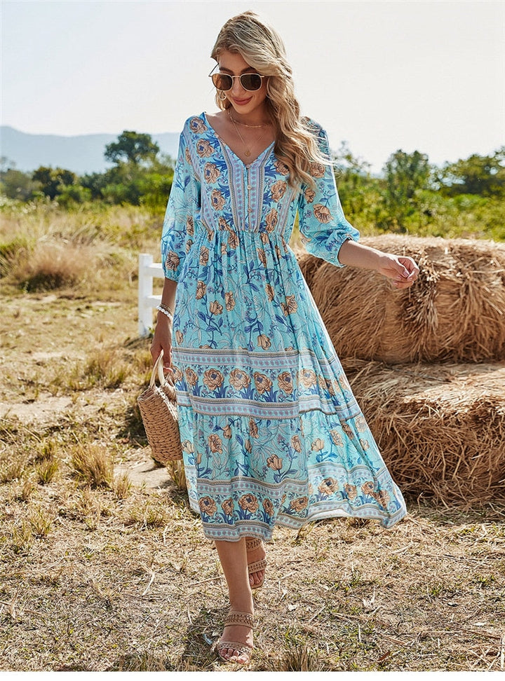 Casual dames midi bloemenjurk met losse pasvorm in Ibiza stijl, voorzijde.