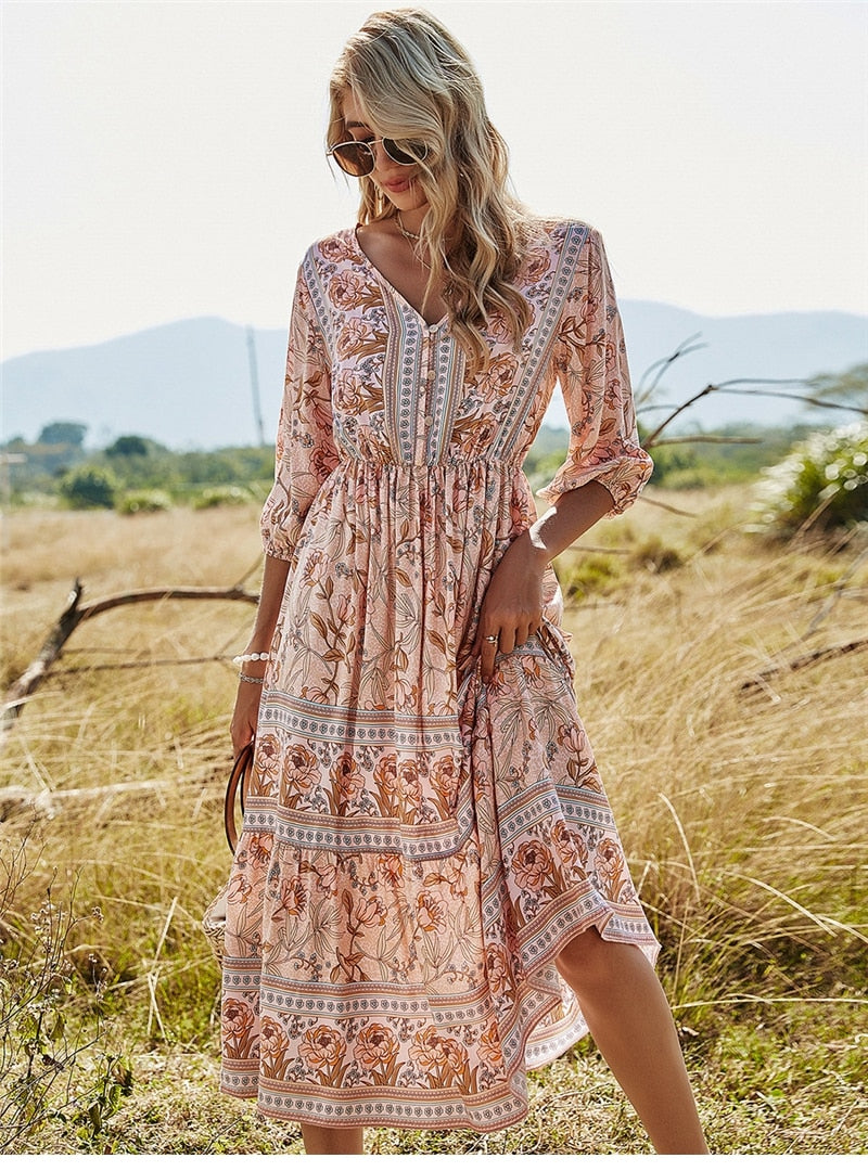 Casual dames midi bloemenjurk met losse pasvorm in Ibiza stijl, achterzijde.