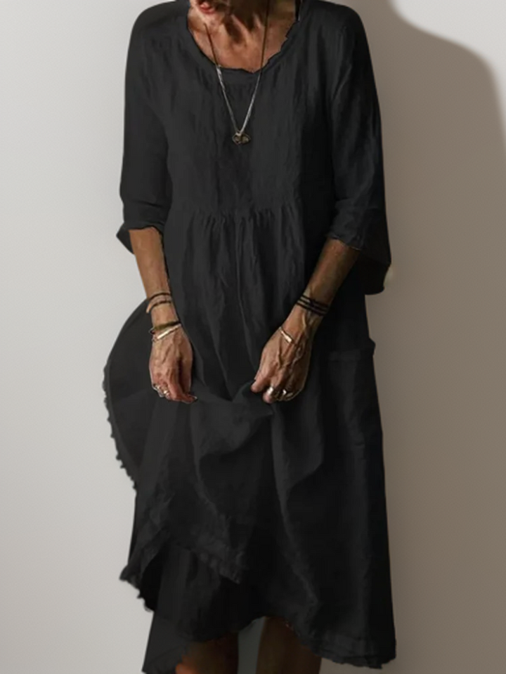 Dames zomerjurk met ronde hals, midi-lengte, tijdloos design, ideaal voor zomerse gelegenheden.