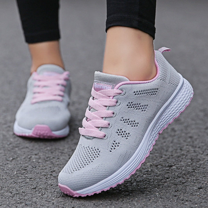Lichte orthopedische sportschoenen voor dames, ideaal voor sport en vrije tijd, in wit met stijlvol design en optimaal comfort.