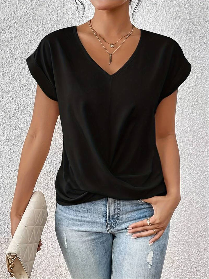 Lichtgewicht damesshirt met V-hals en gedraaide detail, comfortabele pasvorm, perfect voor diverse gelegenheden.
