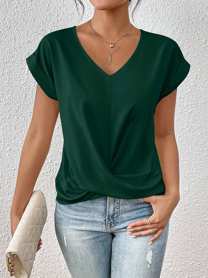 Lichtgewicht damesshirt met V-hals en gedraaide detail, comfortabele pasvorm, perfect voor diverse gelegenheden.