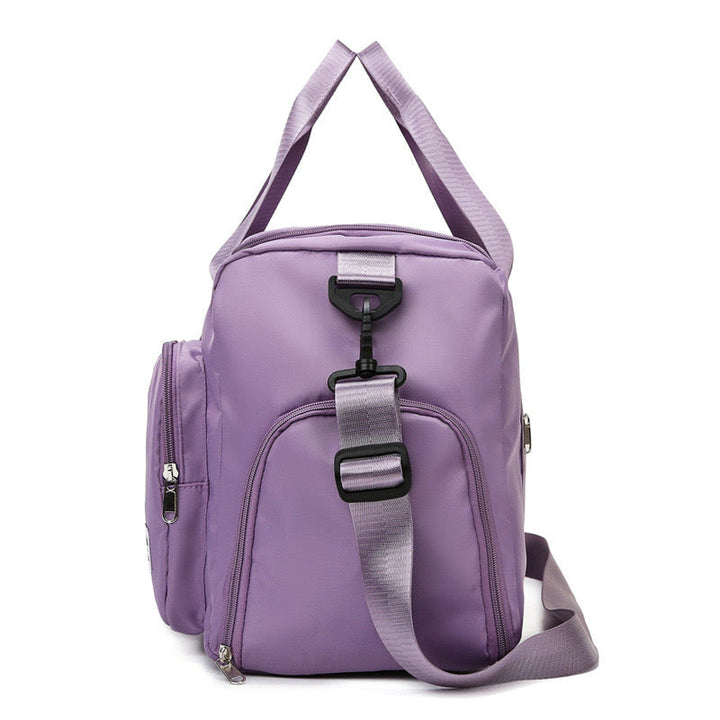 Paarse dames reistas met schoenenvak en meerdere zakken, ideaal voor reizen en sport, stevig en waterdicht.