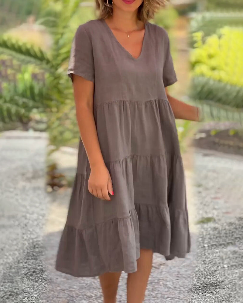 Lucy Zomerjurk, Boho-Chic, V-hals, korte mouw, A-lijn, lichte stof, ideaal voor zomerfeestjes en strandbezoeken. Elegante damesjurk.