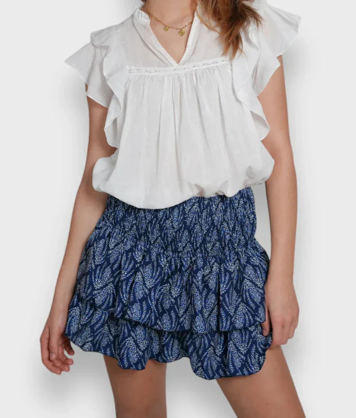 Luchtige, roze dames zomerrok met bloemenprint, ideaal voor warme dagen. Elegante, ademende damesrok.