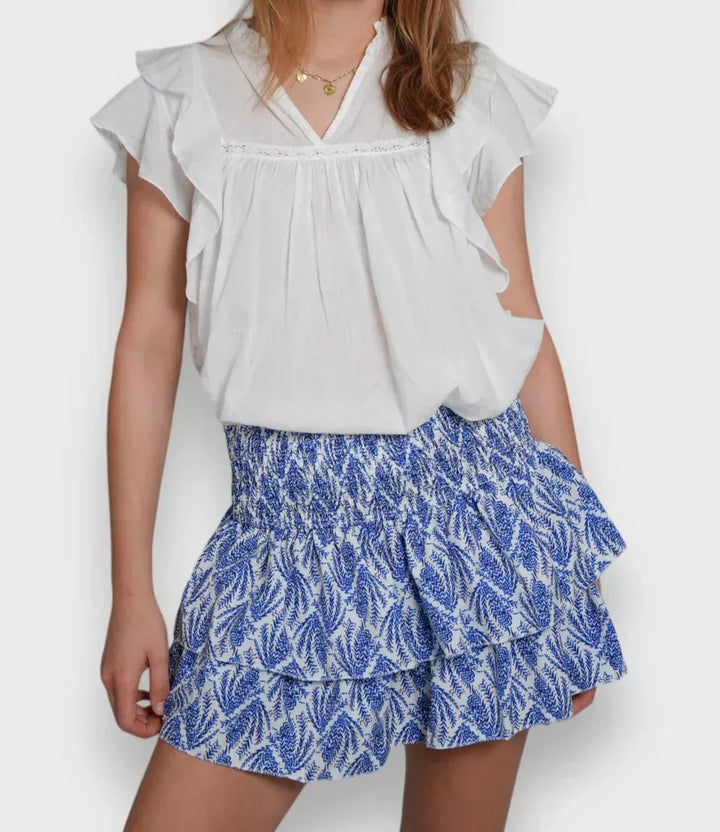 Luchtige, roze dames zomerrok met bloemenprint, ideaal voor warme dagen. Elegante, ademende damesrok.