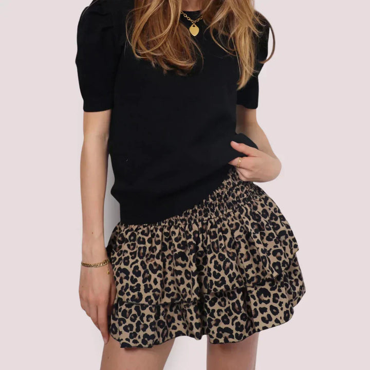 Luchtige, roze dames zomerrok met bloemenprint, ideaal voor warme dagen. Elegante, ademende damesrok.