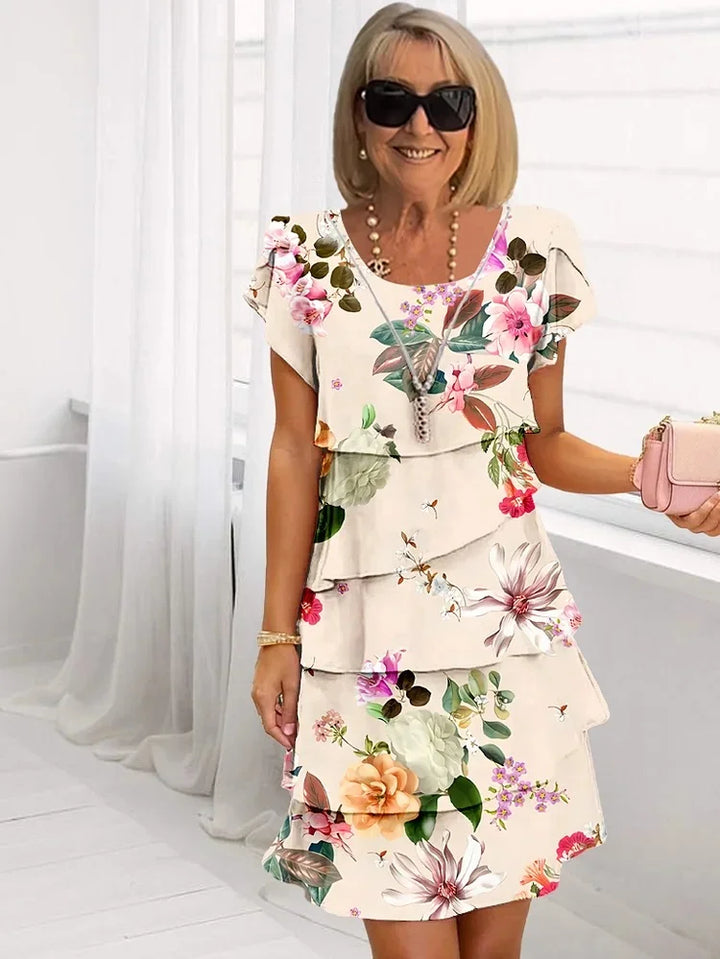 Luchtige dames zomerjurk met bloemenpatroon, elegante snit, licht katoen, ideaal voor warme dagen.