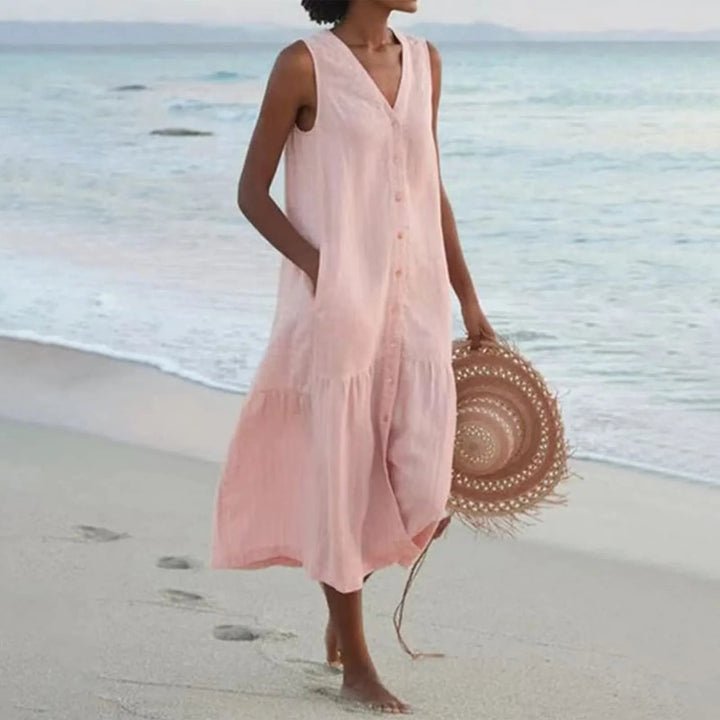 Luchtige dames zomerjurk met knoopsluiting, midi-lengte, elegant ontwerp, perfect voor warme dagen en veelzijdige gelegenheden.