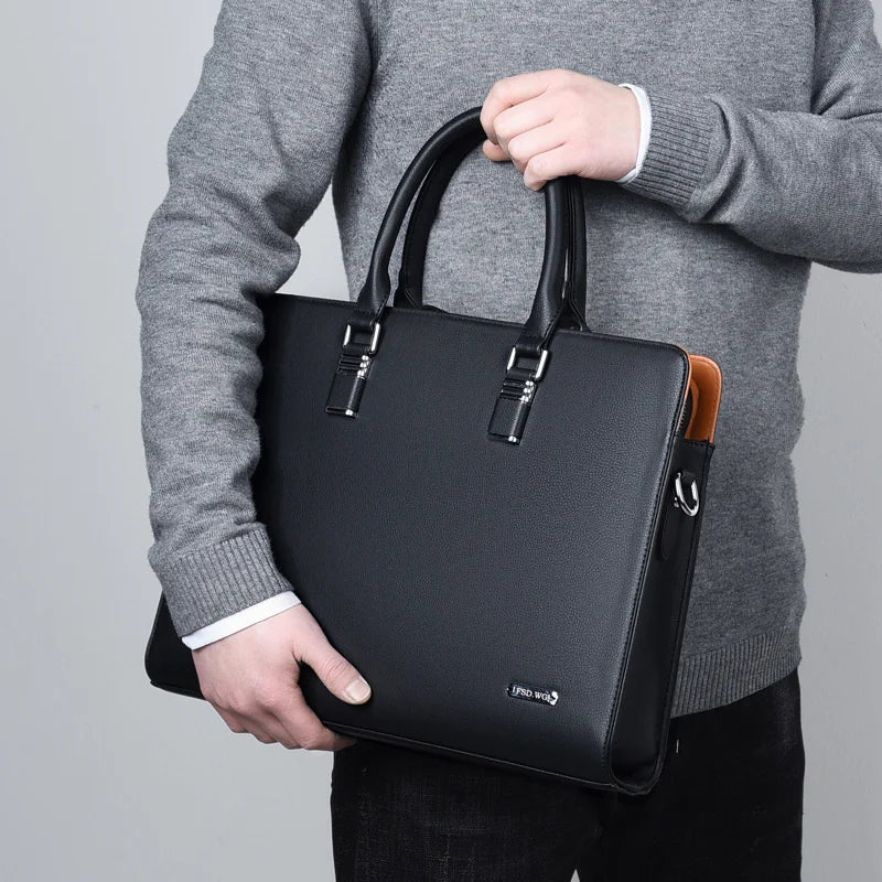 Portaro luxe heren laptoptas in zwart, gedragen als stijlvolle werktas voor 14/15 inch zakelijke laptops.
